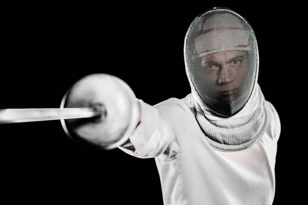 istock Man wearing fencing suit practicing with sword 660434578