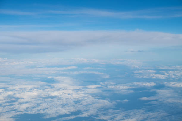 istock White Clouds on the bright sunny blue sky. Nature background. 660435438