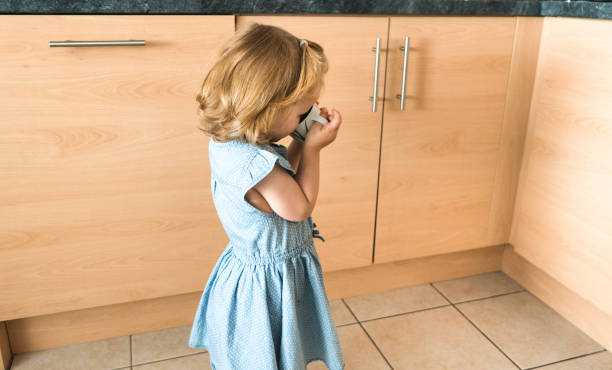 istock mom help the daughter to drink 660449210