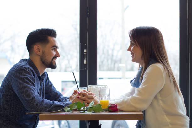 istock Young couple on date in cafe 660449850