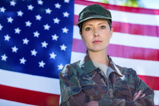 istock Soldier standing in front of american flag 660458400