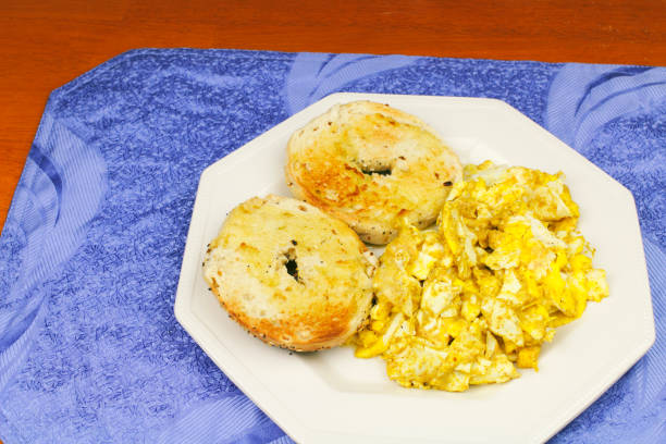 istock Scrambled Eggs with Mustard and Buttered Bagels 660461784