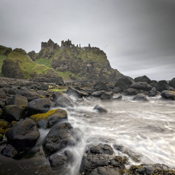 istock Ancient Dunluce Castle on a cliff, Ireland 660465368
