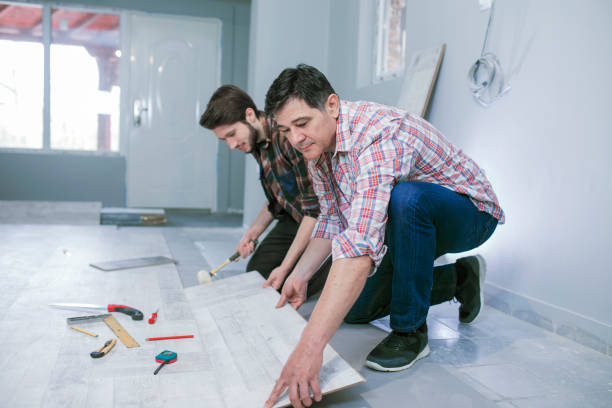 istock Carpenters installing a wooden flooring 660465882