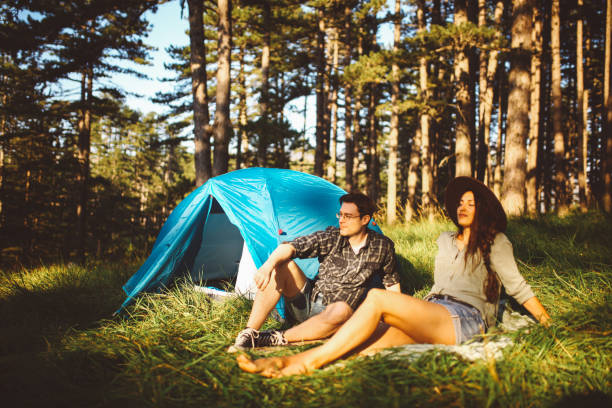 istock Young couple camping in the forest 660479574