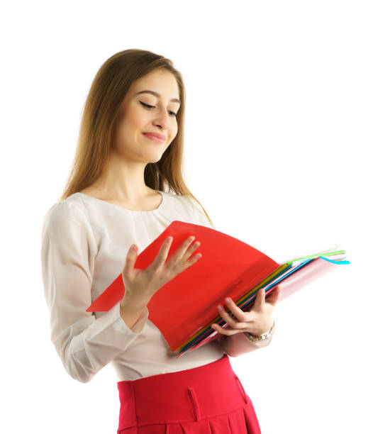 istock Cute young student girl read folders 660488934
