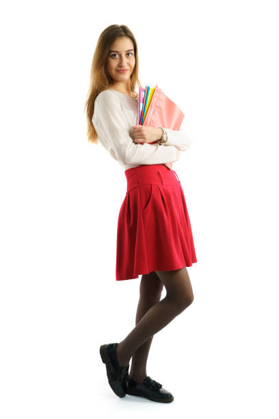 istock Cute young student girl with folders 660488938