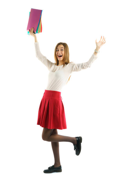 istock Cute young student girl with folders 660488972