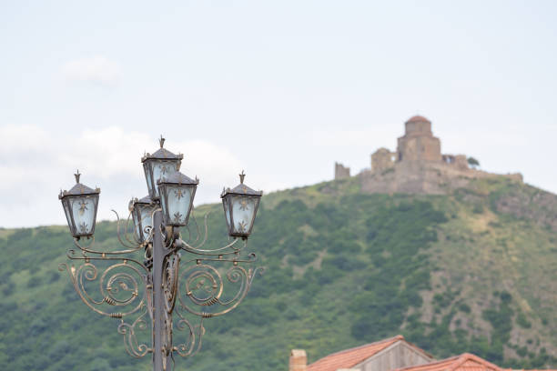 Street lamp with Jvari monastery, the sixth century Georgian Orthodox monastery, at the background