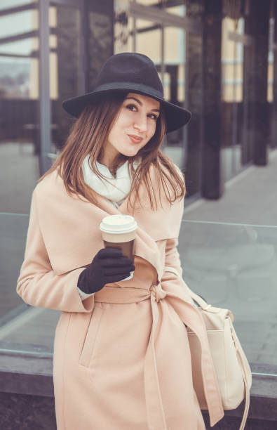 istock Woman holds a cup of coffee 660497470