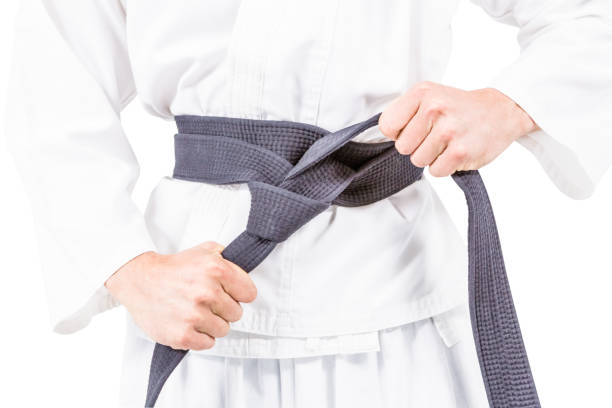 istock Fighter tightening karate belt 660500318