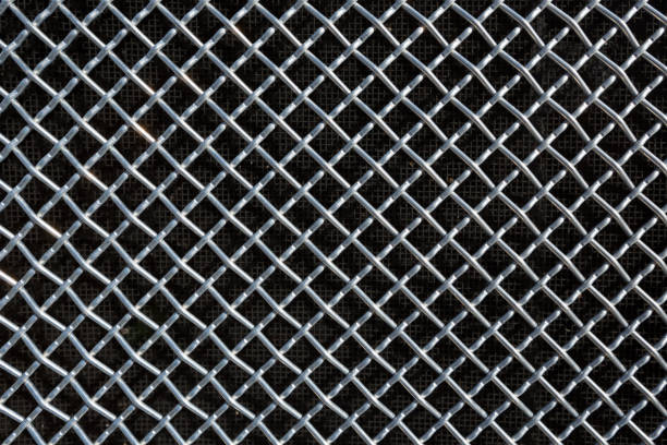 istock metal mesh or aluminum grid on black background 660503262