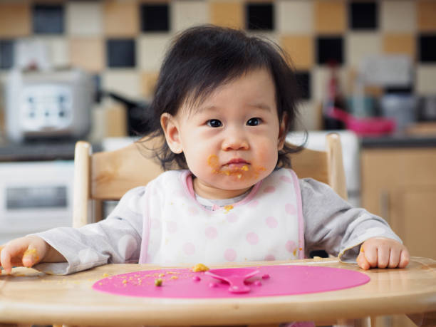 istock eating mess baby girl 660504138