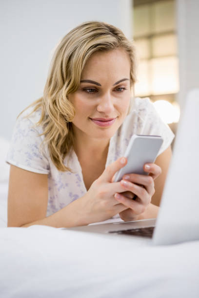 istock Woman text messaging on mobile phone 660504158