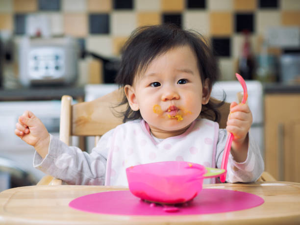 istock eating mess baby girl 660504230