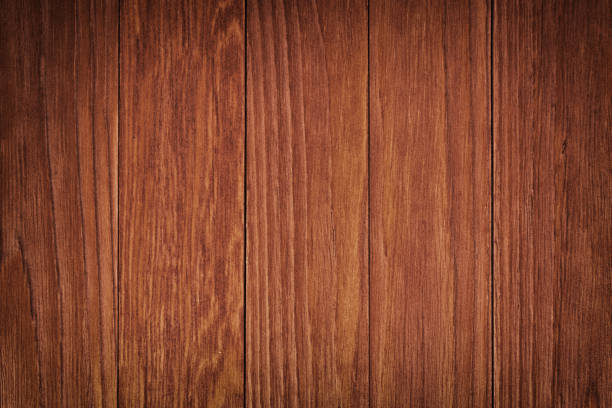 istock Dark brown scratched wooden cutting board. Wood texture 660510054