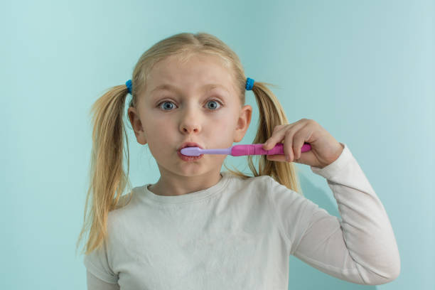 istock Young Girl Child Brushing Teeth 660516758