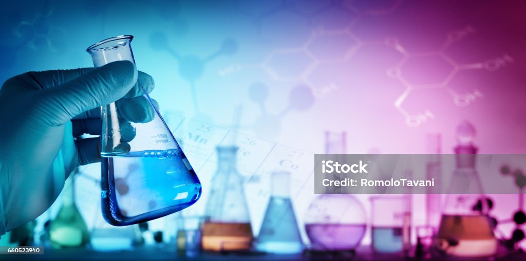 Beaker With Formula In Laboratory Research And Innovation - Flash in Hand Chemical Stock Photo