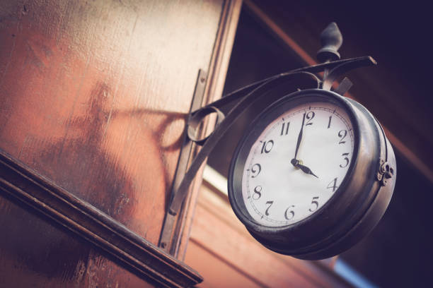 istock vintage clock on a wooden wall 660527820
