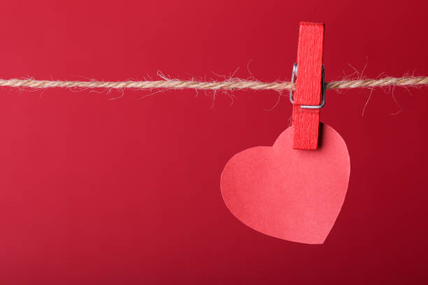 istock Red heart hanging on line 660536504