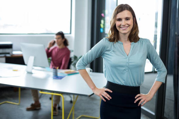 istock Business executive standing with hands on hip in office 660537156