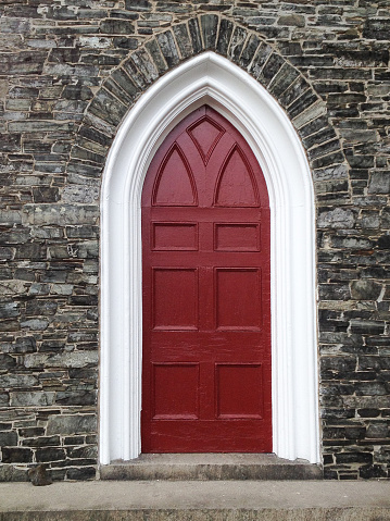 Antique red door of an old building