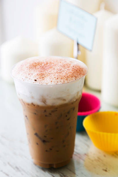 istock Ice coffee with milk foam on table 660537734