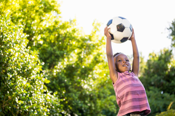 Boy is catching a soccer ball