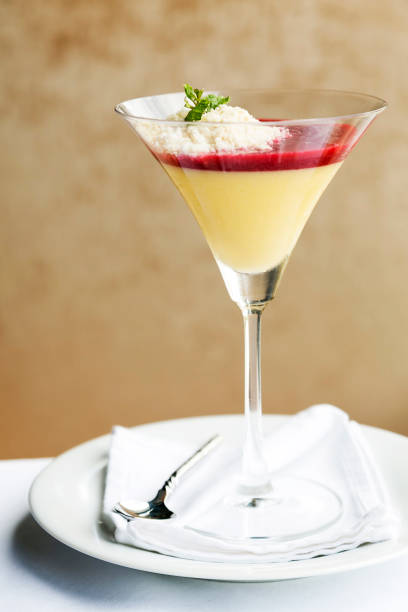 istock Desserts - Panna Cotta in cocktail glass on table 660544728