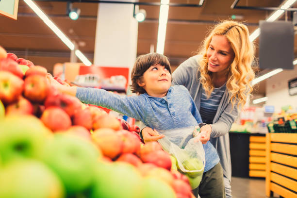 istock Mother and Son In A Supermarket 660547036