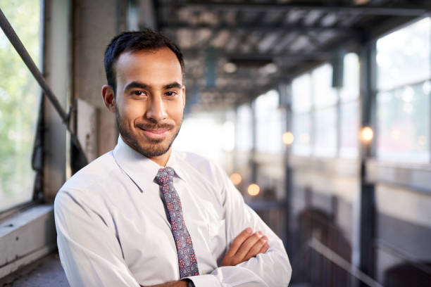 istock Indian businessman smiling confidently with cityscape background 660550802