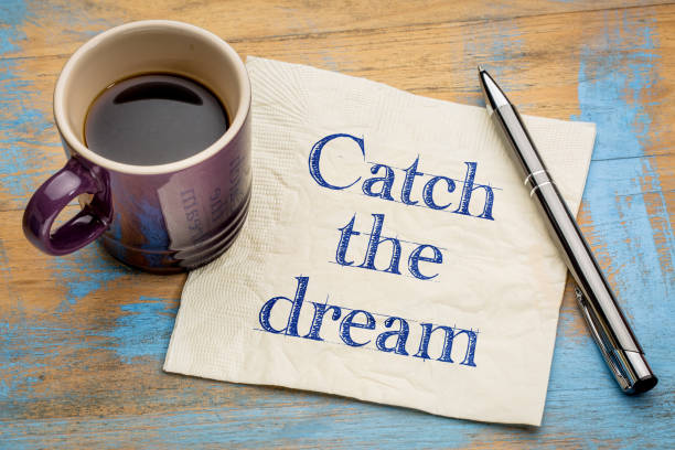 istock Catch the dream inspirational writing on napkin 660553744