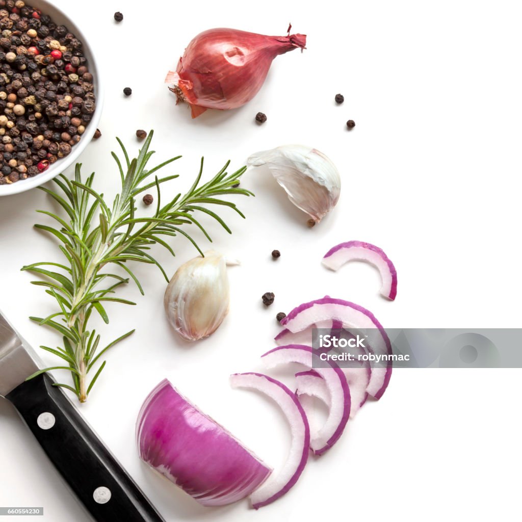 Food Background Top View Food background top view, with red onion, rosemary, garlic, peppercorns, isolated on white. Onion Stock Photo