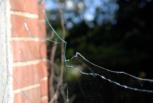 istock Close-Up Of Broken Glass Window 660563545