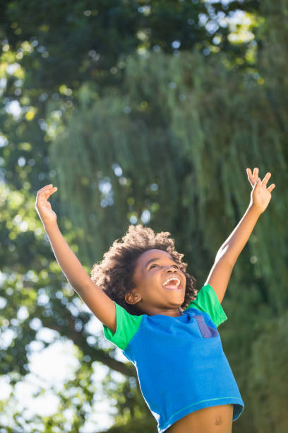 istock Boy is raising his arms 660566518
