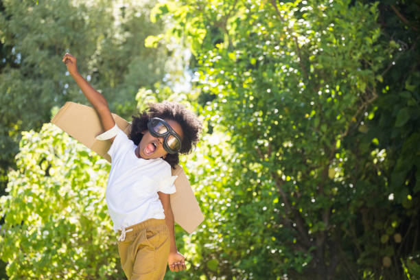 istock Boy playing as an aviator at park 660567168