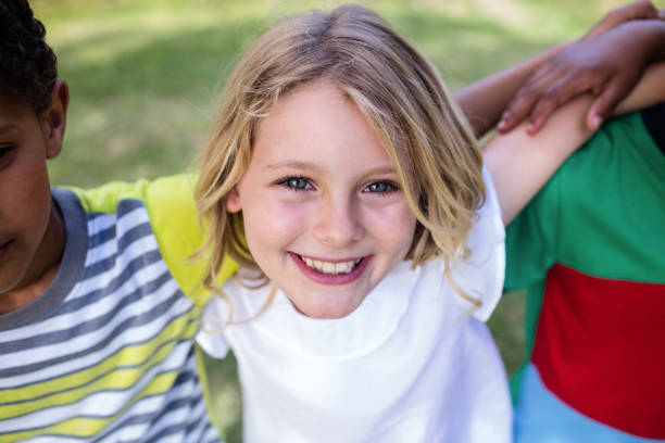 istock Happy girl standing in park 660569662