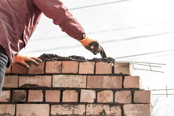 istock Worker builds a brick wall in the house 660570196