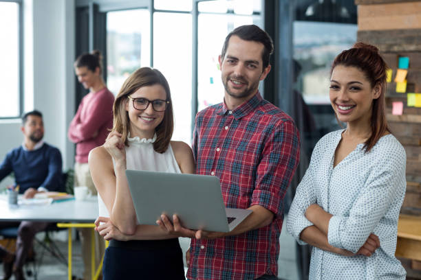 istock Businesspeople having discussion over laptop in office 660572638