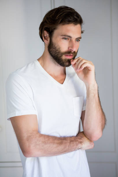 istock Tense man standing in bedroom 660573054