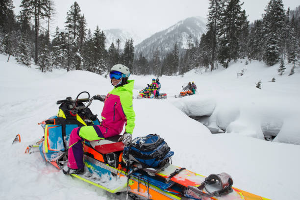 istock Snowmobile tour in snow mountains. 660576662
