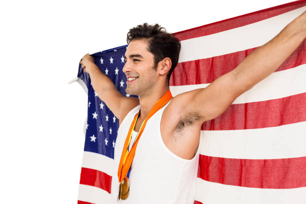 istock Athlete posing with gold medals after victory 660582310
