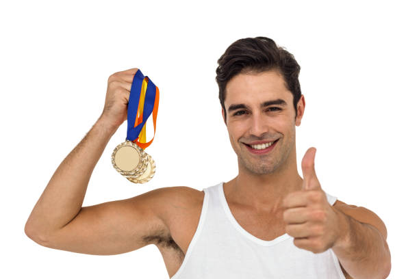 istock Athlete posing with gold medals 660582826