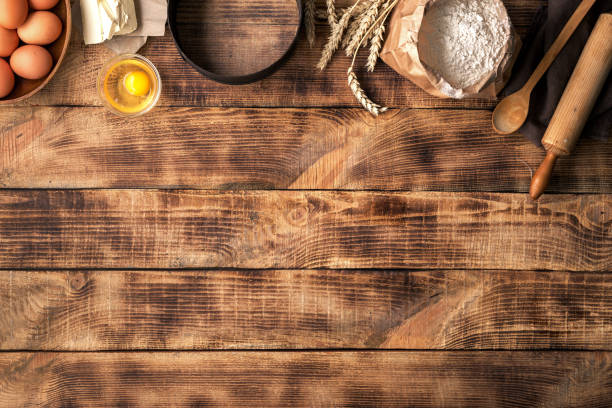 istock Baking ingredients on a wooden table with copy space 660582834