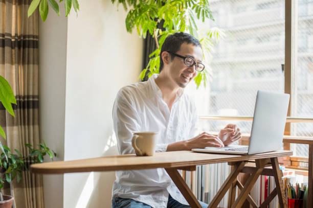 istock Mid adult man working at home on holiday 660586498
