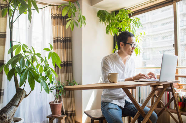 istock Mid adult man working at home on holiday 660586500