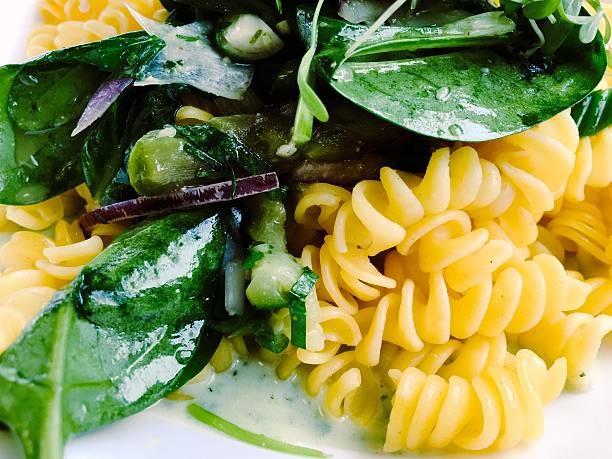 Close-Up Of Pasta With Vegetable Served In Plate