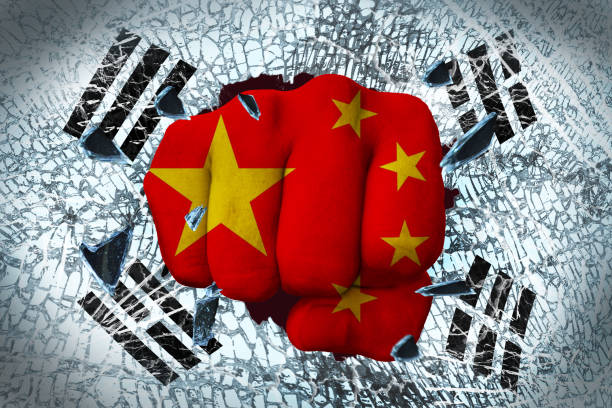 istock china's fist that broke through the Korean flag 660589712