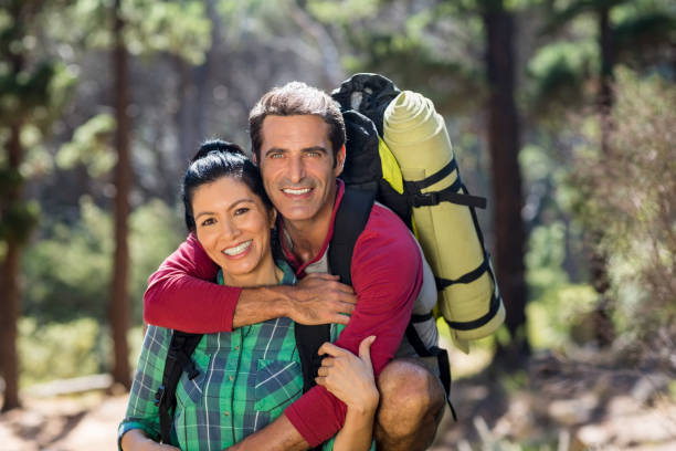 istock Couple smiling and holding each other 660591084