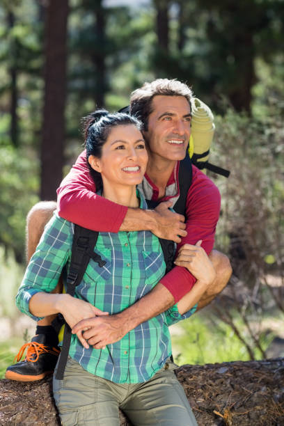 istock Couple smiling and holding each other 660591148